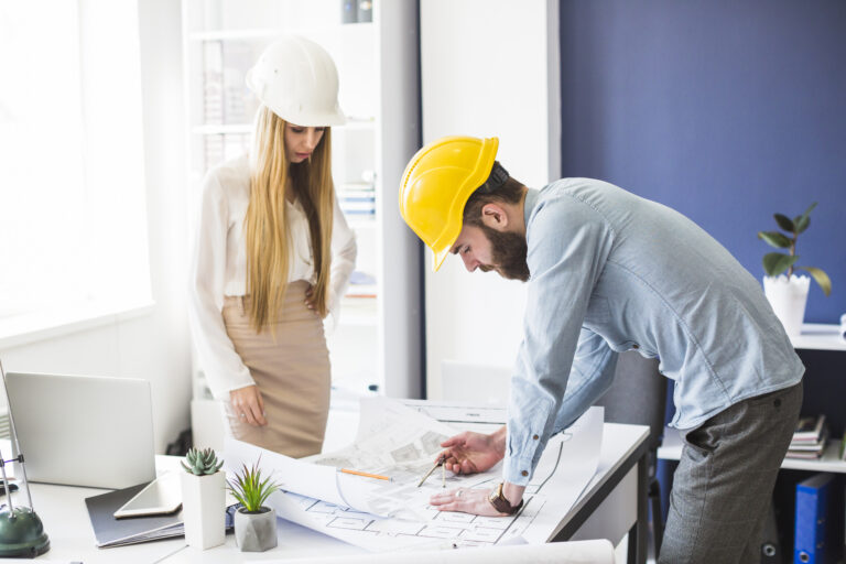 male-female-engineer-working-plan-office